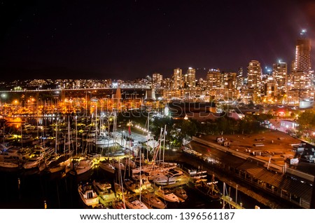 Night skyline of Granville harbour with lots of boats, Vancouver