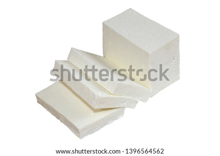 Paneer White fresh cheese common in the Indian subcontinent slab and thick slide Royalty-Free Stock Photo #1396564562