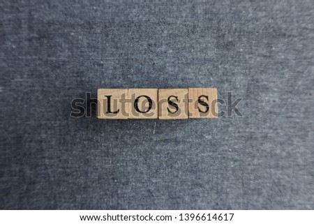  Alphabet blocks, wood texture and blue jeans background                              