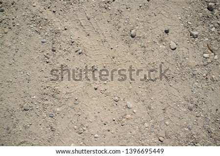 Dusty Road with Small Rocks, Dirt, Footprints, Car and Bicycle Traces Texture