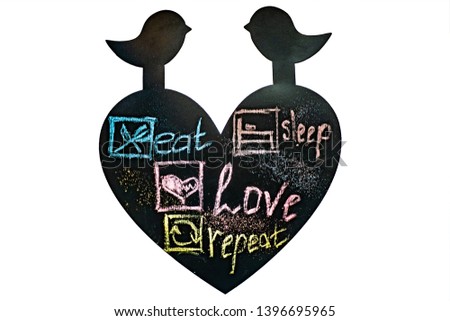 Isolated  Illustrations of inscription on black chalkboard. Eat, sleep, love, repeat. Chalk pictures of diet, lifestyle theme.