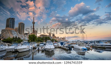 Modern Toronto skyline with reflection at sunset. Ontario, Canada