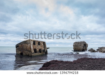 Liepaja beach bunker. Brick house, soft water, waves and rocks. Abandoned military ruins facilities in a stormy sea. Barracks building in the Baltic sea.  Liepaja, Latvia, Europe. Royalty-Free Stock Photo #1396794218