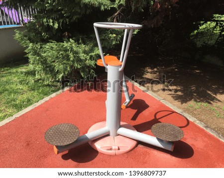 Outdoor fitness equipment on red background