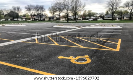 Handicapped disabled icon sign on parking lot or space area in the parks / With Copy Space