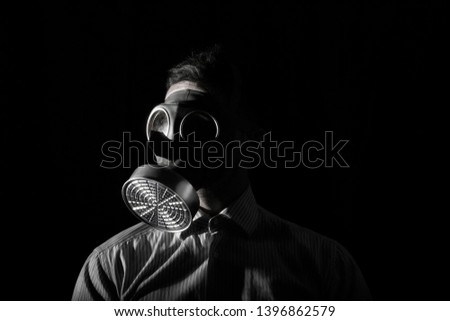 portrait of a man with gas mask