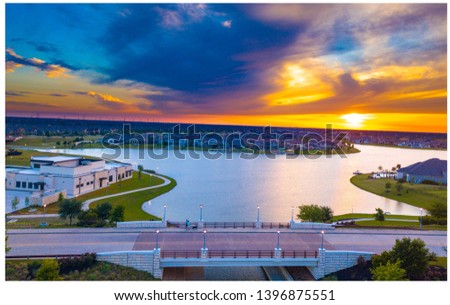 Sunset over the bridge in Cypress Texas Royalty-Free Stock Photo #1396875551