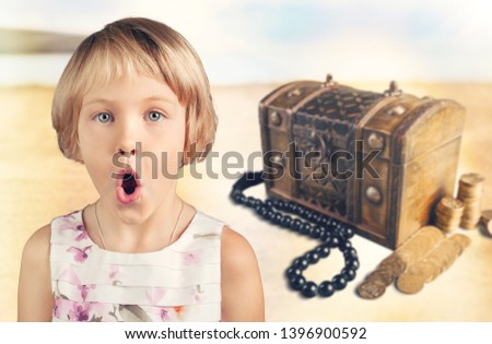 Child and Open treasure  with gold coins