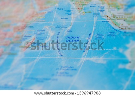 Indian Ocean in close up on the map. Focus on the name Indian Ocean. Vignetting effect. Royalty-Free Stock Photo #1396947908