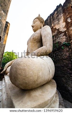 Ancient Buddha statue in Phra Si Ratana Mahathat Chaliang temple, Thailand.
