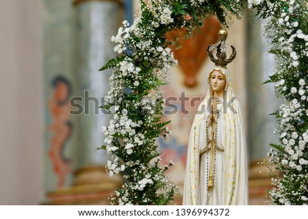 Statue of the image of Our Lady of Fatima, mother of God in the Catholic religion, Our Lady of the Rosary of Fatima, Virgin Mary Royalty-Free Stock Photo #1396994372