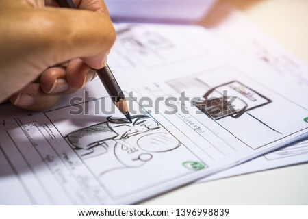 Pencil on Storyboard movie layout for pre-production, storytelling drawing creative for process production media films. Script video editors and writing graphic in form displayed in maker shooting