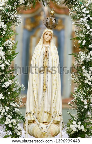 Statue of the image of Our Lady of Fatima, mother of God in the Catholic religion, Our Lady of the Rosary of Fatima, Virgin Mary Royalty-Free Stock Photo #1396999448