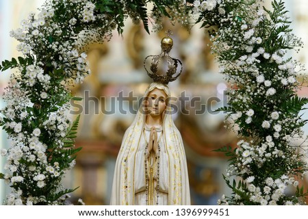 Statue of the image of Our Lady of Fatima, mother of God in the Catholic religion, Our Lady of the Rosary of Fatima, Virgin Mary Royalty-Free Stock Photo #1396999451