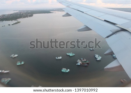 It's raw picture that I took while having Yogyakarta-Bali flight. A view that I saw from the air. So many ships on the water