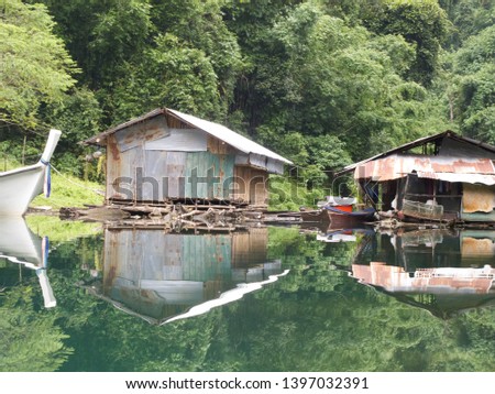 Floating house in Ratchaprapa Dam in Thailand