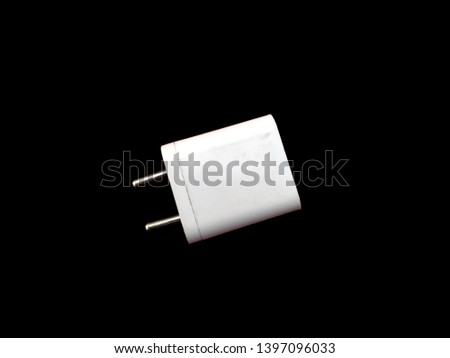 white mobile charger  isolated on black background