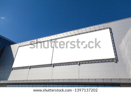 Mockup of street billboard on the facade of the exhibition complex, a huge banner ad, large format