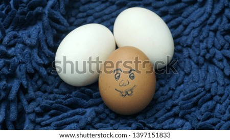  Funny eggs on dark blue background. Humor concept                              