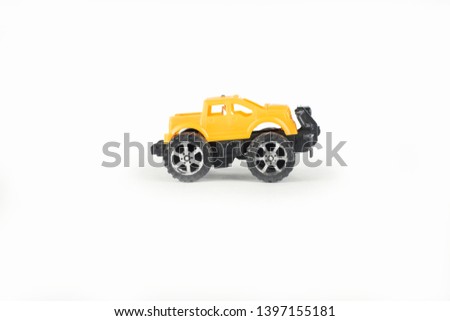 Yellow toy car jeep on a white background