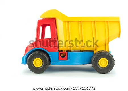 Children's toy yellow truck with a red body on a white background