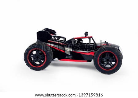 Toy sports car with driver inside on a white background