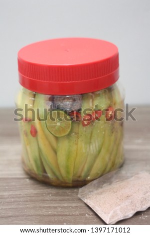 Jar of Manggo - Malaysian Manggo packed mixed of chillies, preserved plum (asam boi) with it powdered and calamasi lime