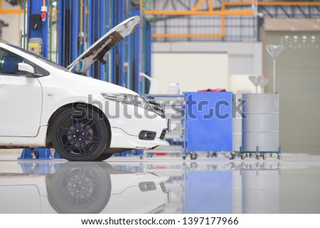 White floor for parking, preparing to repair car pictures in showrooms, parking spaces, waiting for repairs at new branches and car service centers on the epoxy floor in new car factory service.