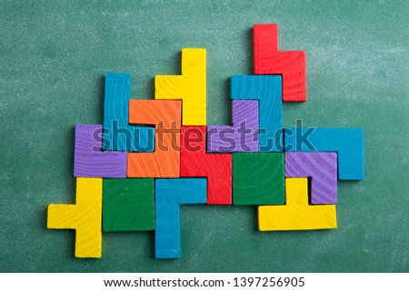 Creative solution for idea - business concept, jigsaw puzzle on the green blackboard Royalty-Free Stock Photo #1397256905