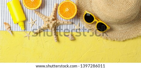 Summer vacation accessories on color background, space for text and top view. Happy holidays