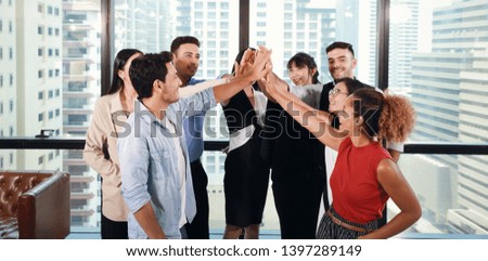 Close up of multiethnic business people stacking hands together meaning of teamwork concept