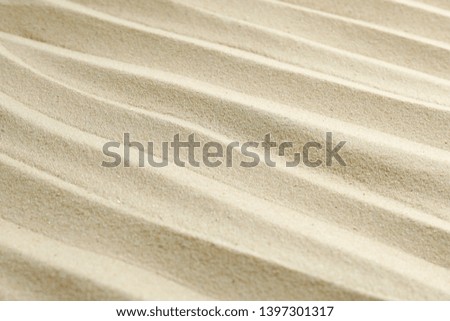 Clear sea sand as background, space for text and closeup. Summer vacation background