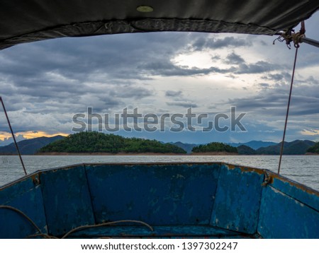 View of the boat seat,Sea storm landscape. Dramatic overcast sky.Sunset sky, The lake at sunset