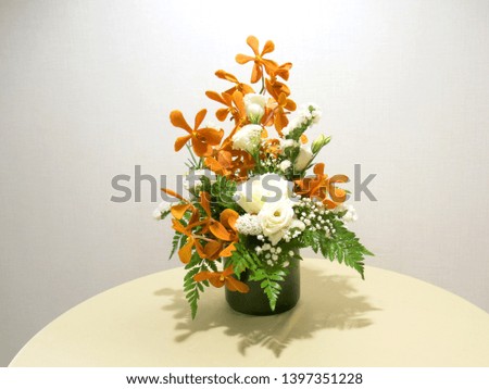 Fresh orchid with green leafs  on the table.                             