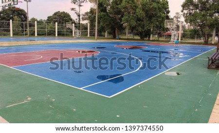 Picture of the basketball field after being hit by a storm