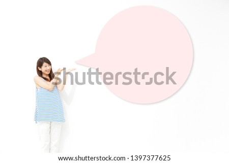 Asian woman pointing side on white
