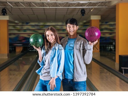 Portrait of friends in bowling club