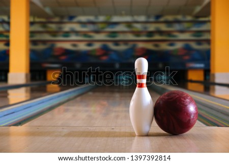 Pin and ball on floor in bowling club