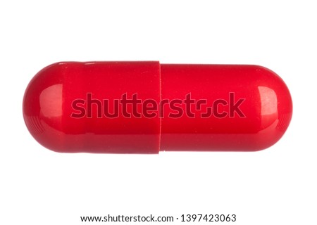 red pills isolated on white Royalty-Free Stock Photo #1397423063