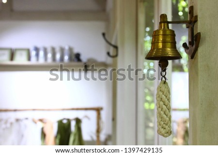 little brass bell decoration in shop decorated in vintage style