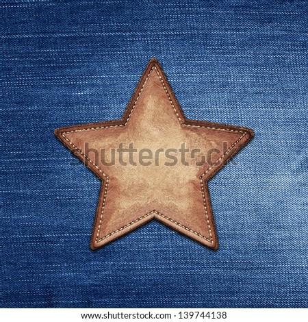 Star shape leather label on jeans texture