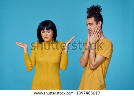 young couple on a blue background                              