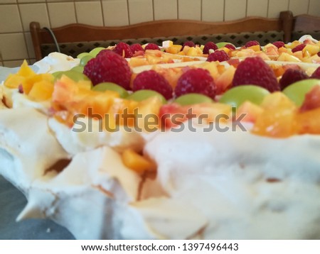 Birthday pavlova cake with various fruits.