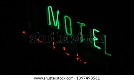 Motel Advertising Panel with Red and Green Neon Letters Lighting