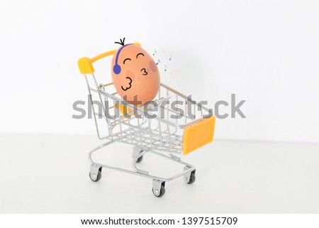Closeup cute egg enjoyment and happy relaxation design in kitchen on white background. Egg music in trolley on white background.