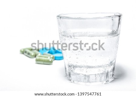Closeup Green and Blue Medicine With Water On White Background