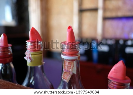 plastic bottle caps in alcohol