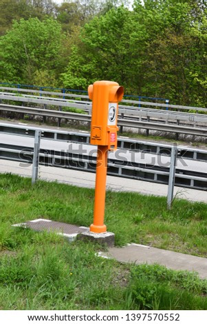 orange emergency phone column at the autobahn