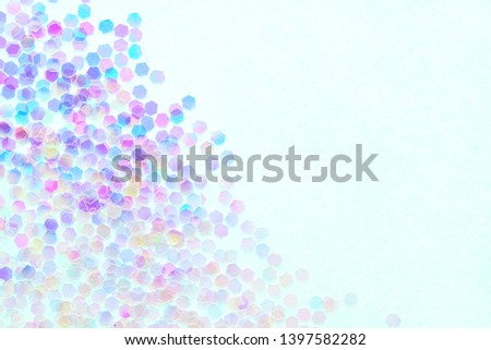 Confetti  on a blue background, festive concept.  Perfect place for your design.