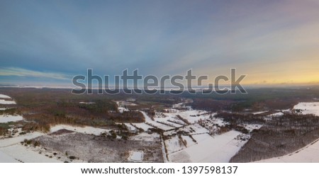 Winter aerial landscape photographed from drone. European winter with snow.